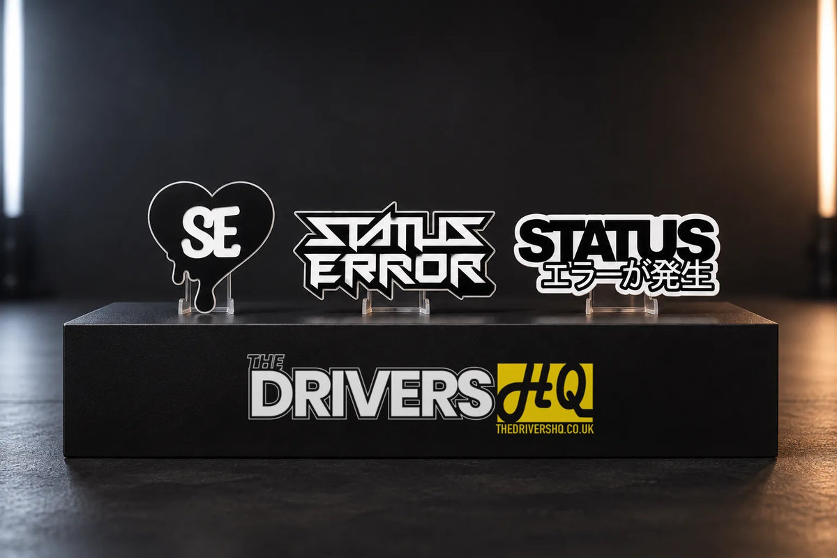 Status Error Heart Drip, Logo Outline and Classic Logo stickers standing on a black display plinth
