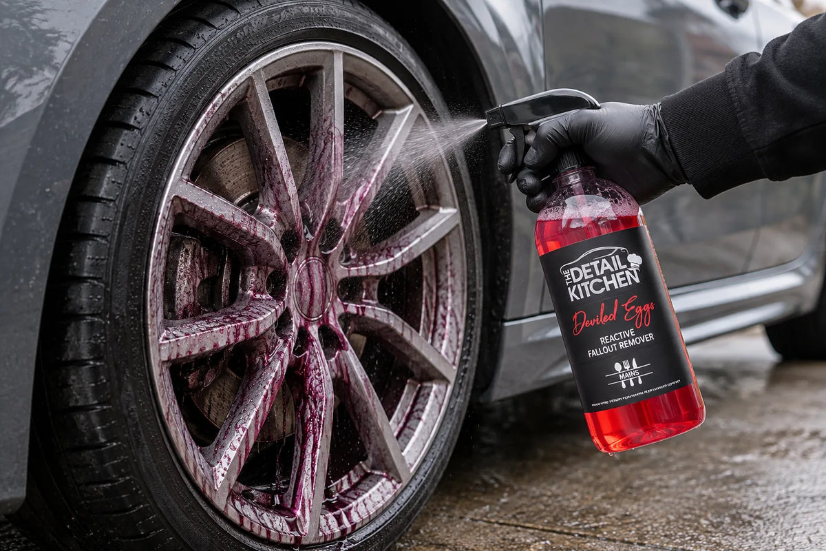 The Detail Kitchen Deviled Eggs fallout remover sprayed onto an alloy wheel, turning purple as it reacts