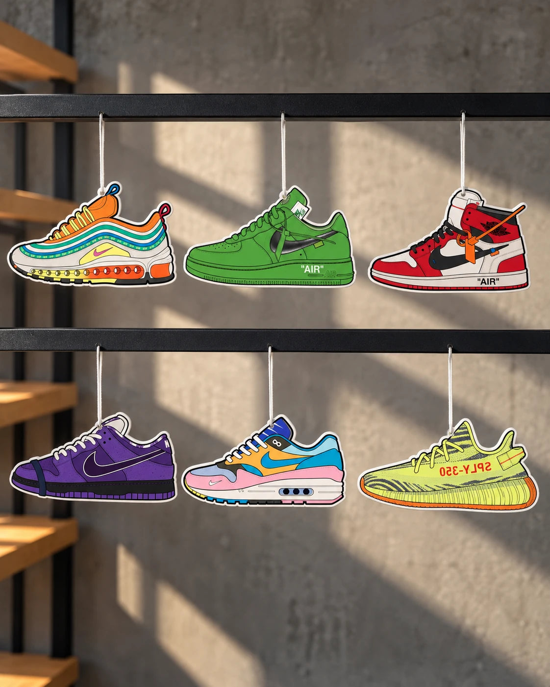 The Hyped Source trainer air fresheners on a display rail: London AM97, Off-White AF1 Brooklyn, Off-White AJ1 Chicago, SB Purple Lobster, Sean Wotherspoon Bespoke AM1 and Yeezy 350 Yebra