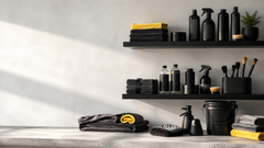 Wall shelves and a worktop with bottles, folded towels, brushes and a bucket.