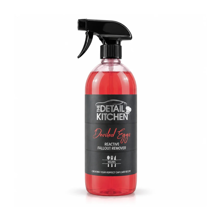 The Detail Kitchen Deviled Eggs reactive fallout remover trigger bottle with red liquid and a charcoal label, studio photo on white