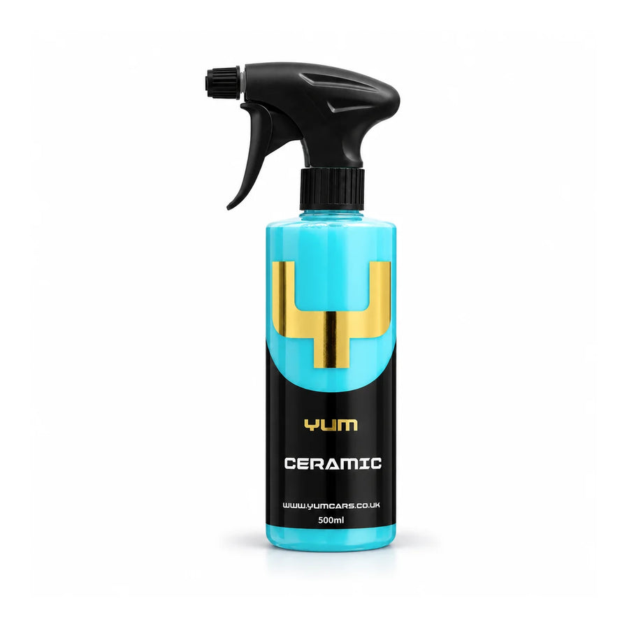 Yum Ceramic spray sealant 500ml trigger bottle with turquoise liquid, a black label and gold Y mark, studio photo on white