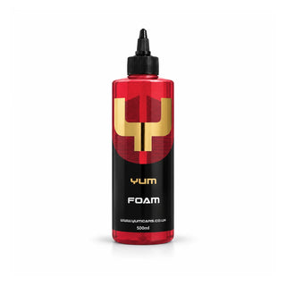 Yum Foam pH neutral snow foam 500ml bottle with deep red liquid, a black nozzle cap and gold Y mark, studio photo on white