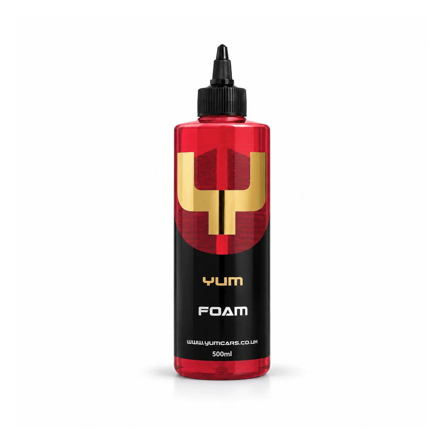 Yum Foam pH neutral snow foam 500ml bottle with deep red liquid, a black nozzle cap and gold Y mark, studio photo on white