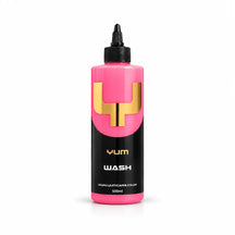 Yum Wash pH neutral shampoo 500ml bottle with bubblegum pink liquid, a black nozzle cap and gold Y mark, studio photo on white