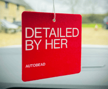 Autobead Oriental Nights scent air freshener, a red felt card printed DETAILED BY HER, hanging in a car window
