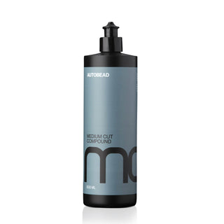Autobead Medium Cut Compound 500ml flip cap bottle with a blue label and black MC mark on a white background