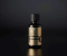 Autobead Alloy Coating 1 Year 30ml glass bottle with a gold label and black AC mark on a dark studio background